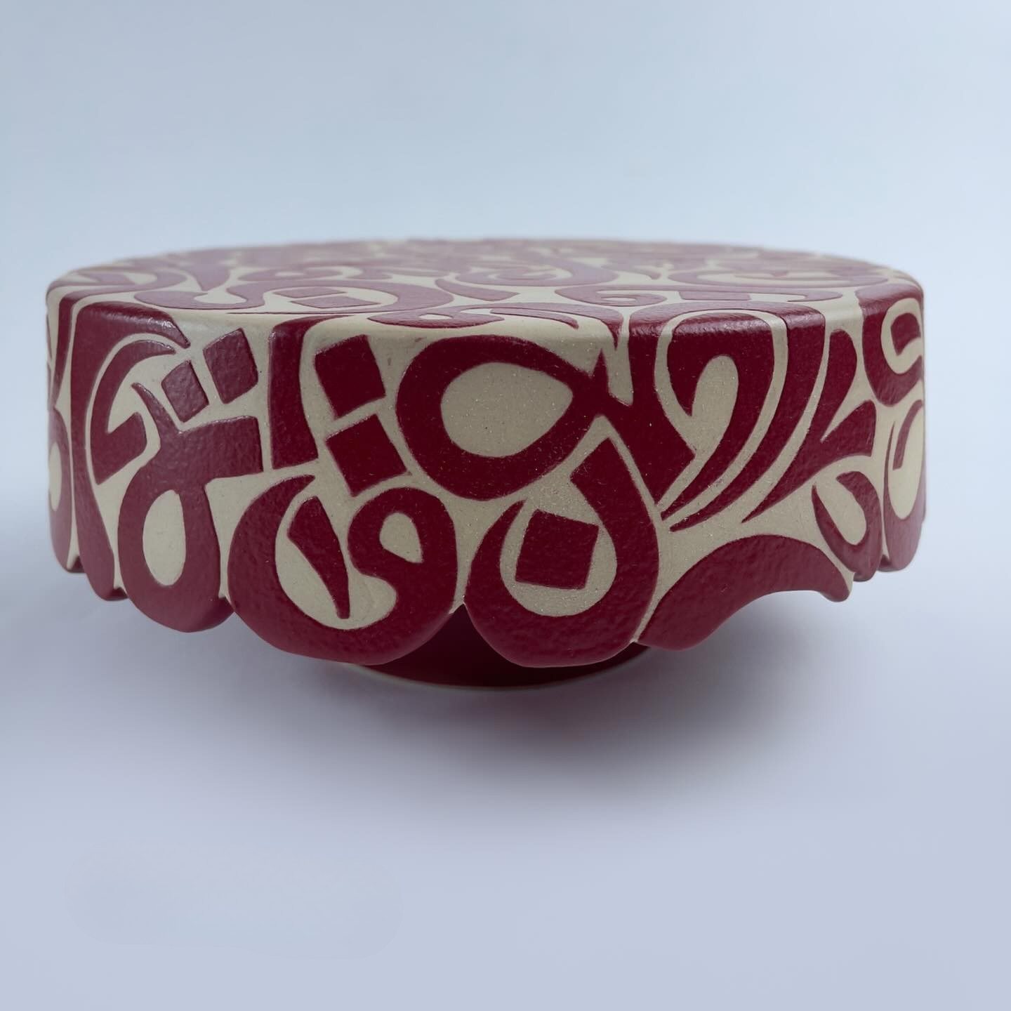 A versatile stand adorned with calligraphy cut edges. Designed for dual use serve cake elegantly on one side