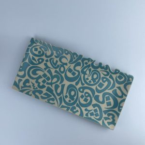 A rectangular platter adorned with calligraphy cut edges