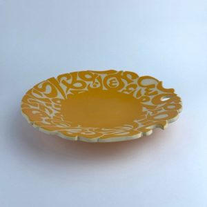 A plate adorned with calligraphy cut edges
