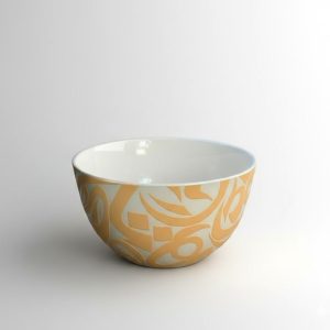 A U-shaped bowl featuring flowing Arabic calligraphy. Designed for both serving and display.