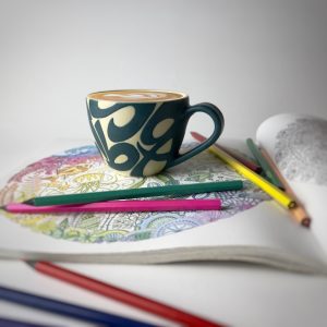 A curved tea cup designed for serving tea or other beverages.