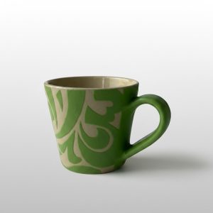 A V-shaped mug featuring calligraphic motifs