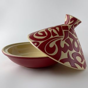 A tajine with a conical lid featuring flowing Arabic calligraphy