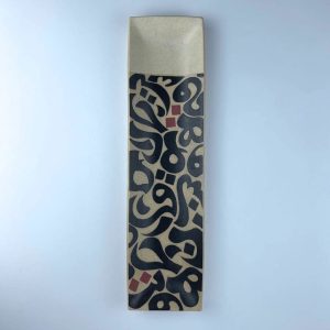 A rectangular tray with black calligraphy motifs