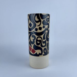 cylindrical vase featuring black calligraphy motifs