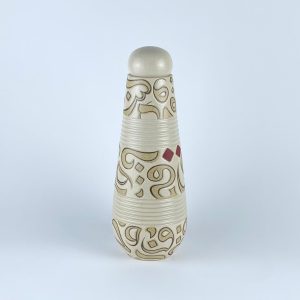 A handleless lidded carafe with flowing beige calligraphy on an earthy ground and subtle red dots.
