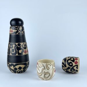 A set consisting of carafe and two tumblers