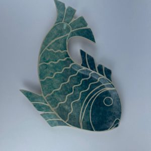 A hand-built fish-shaped plate finished with an ombré effect
