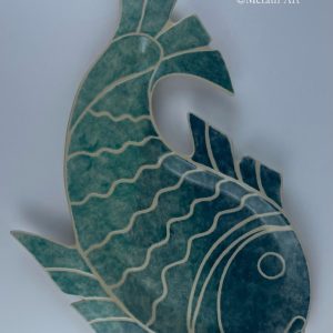 A hand-built fish-shaped plate finished with an ombré effect