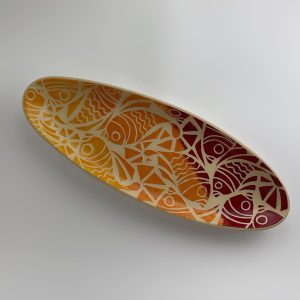 A tapered oval plate  finished with an ombré effect