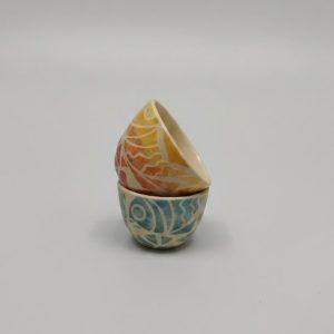 featuring flowing fish motifs. Designed for serving nuts