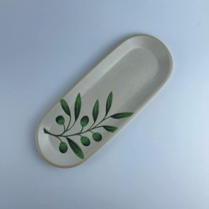 A wide-front oval plate featuring delicate olive branch and leaf motifs with a glossy green interior.  Suitable for serving appetizers