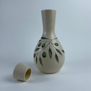 A handleless lidded Qarura (carafe) featuring olive branch motifs. Designed for pouring water and other beverages.