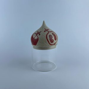 A ceramic dome featuring pomegranate motifs
