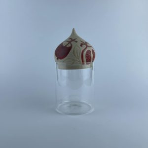 A ceramic dome featuring pomegranate motifs
