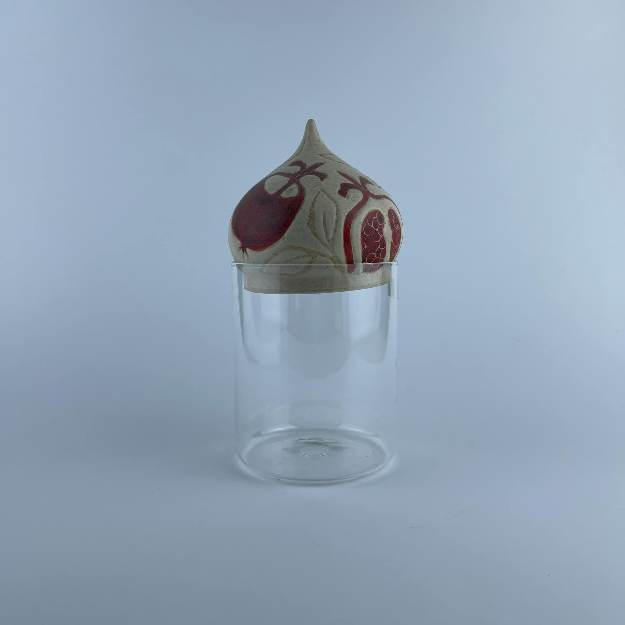 A ceramic dome featuring pomegranate motifs